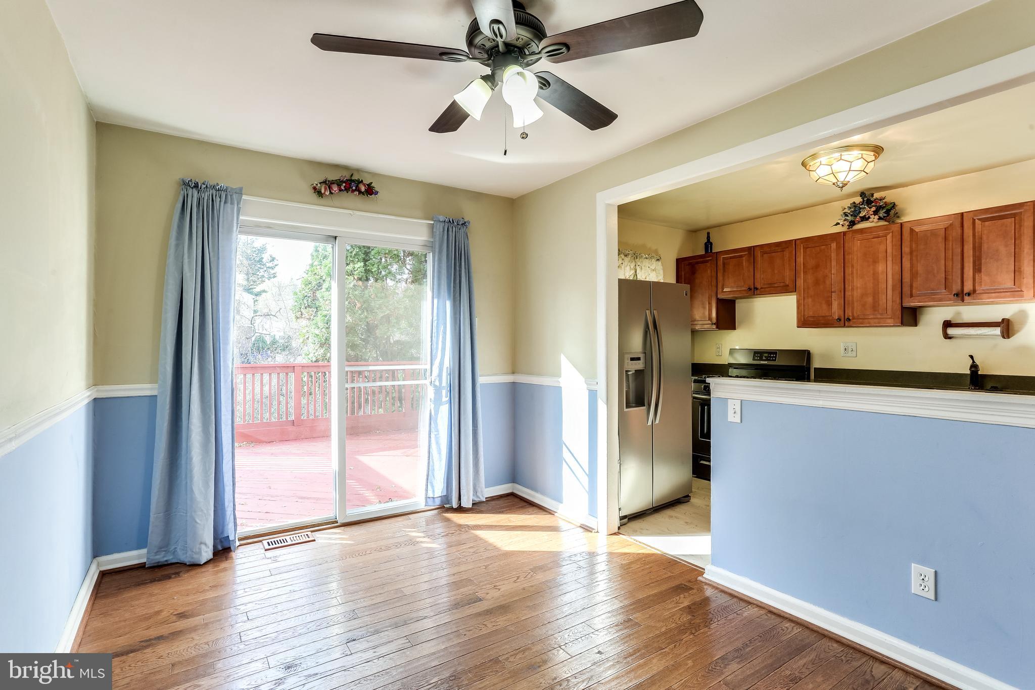 8308 Stillmeadow Road, Unit 1E Baltimore, MD 21236 - Photo 9 of 29 Dining room with slider to deck