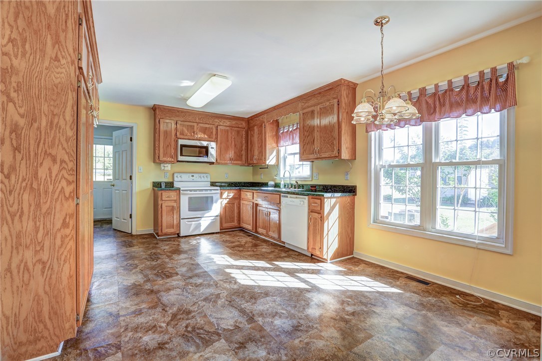 16601 Jolly Road Disputanta, VA 23842 - Photo 20 of 41 a kitchen with stainless steel appliances granite countertop a refrigerator a stove top oven a sink and dishwasher