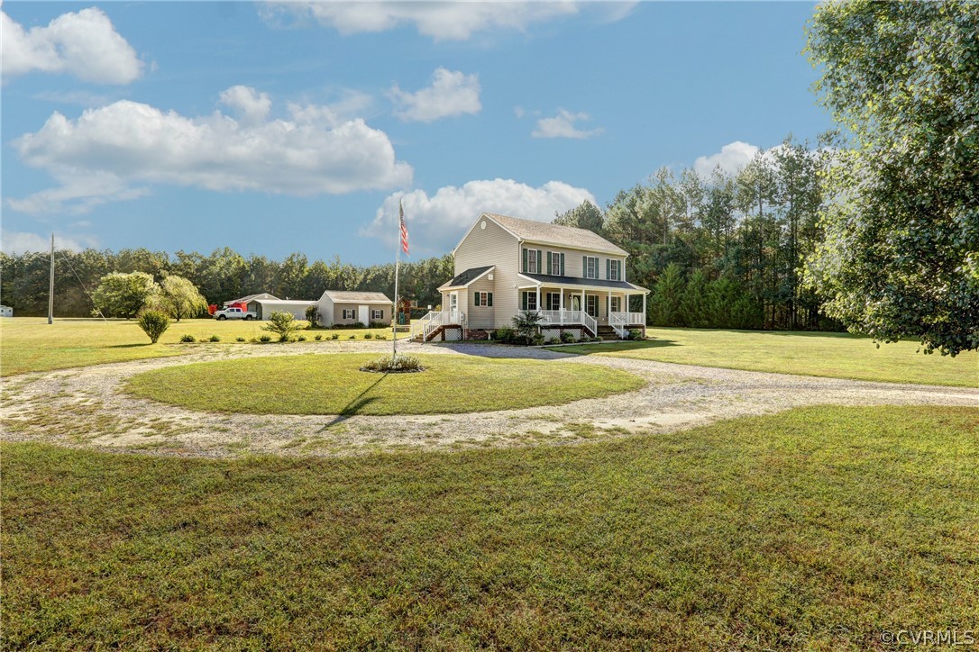 16601 Jolly Road Disputanta, VA 23842 - Photo 2 of 41 a view of a house with a big yard and large trees