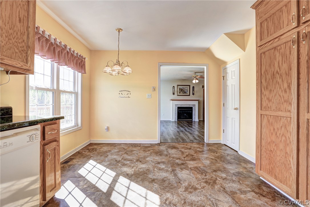 16601 Jolly Road Disputanta, VA 23842 - Photo 21 of 41 a view of a hallway with wooden floor and a kitchen
