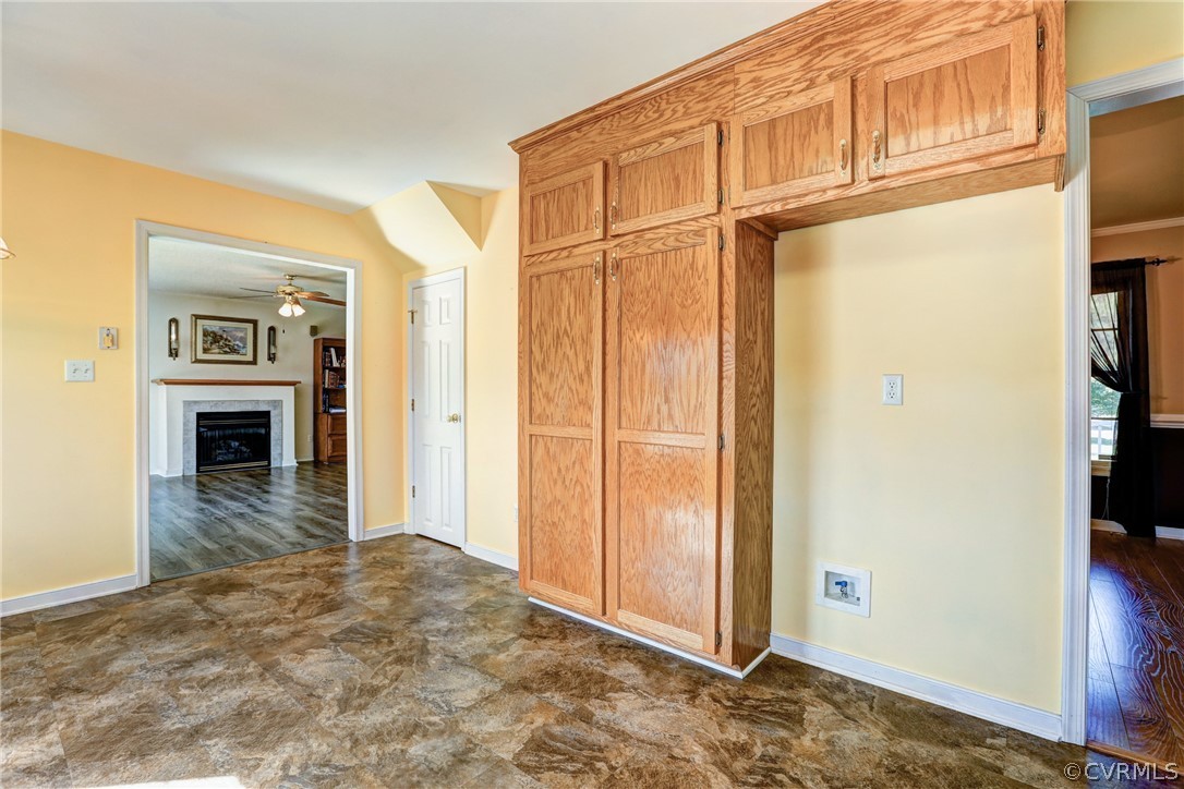 16601 Jolly Road Disputanta, VA 23842 - Photo 23 of 41 a view of a livingroom with wooden floor and a kitchen