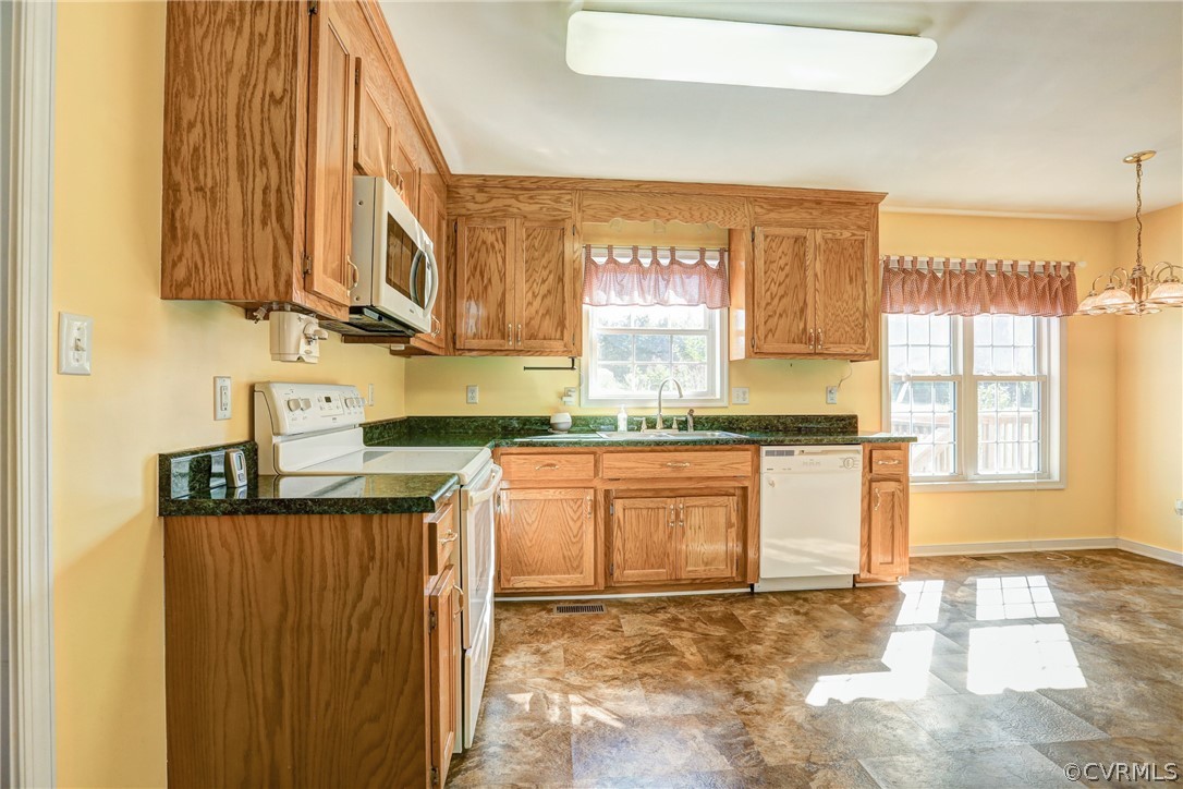 16601 Jolly Road Disputanta, VA 23842 - Photo 24 of 41 a kitchen with stainless steel appliances granite countertop a sink and a cabinets