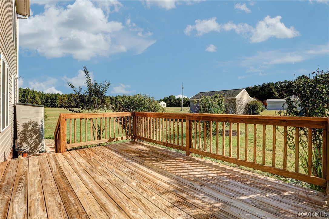 16601 Jolly Road Disputanta, VA 23842 - Photo 25 of 41 a view of balcony with wooden floor and fence