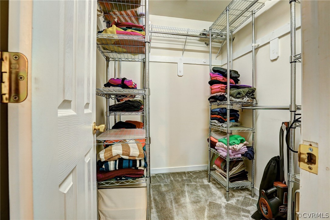 16601 Jolly Road Disputanta, VA 23842 - Photo 32 of 41 a view of walk in closet with clothes and shoes