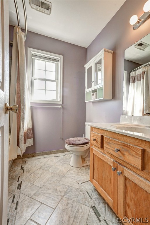16601 Jolly Road Disputanta, VA 23842 - Photo 35 of 41 a bathroom with a sink toilet and window