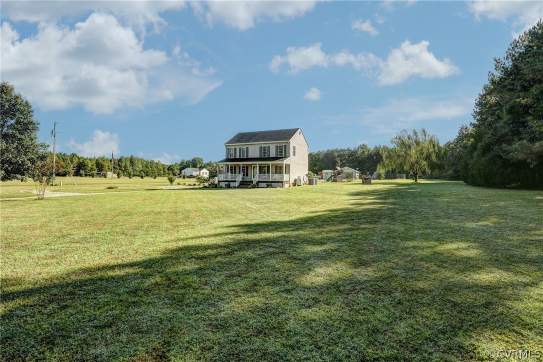 16601 Jolly Road Disputanta, VA 23842 - Photo 5 of 41 a swimming pool is in the middle of a big yard