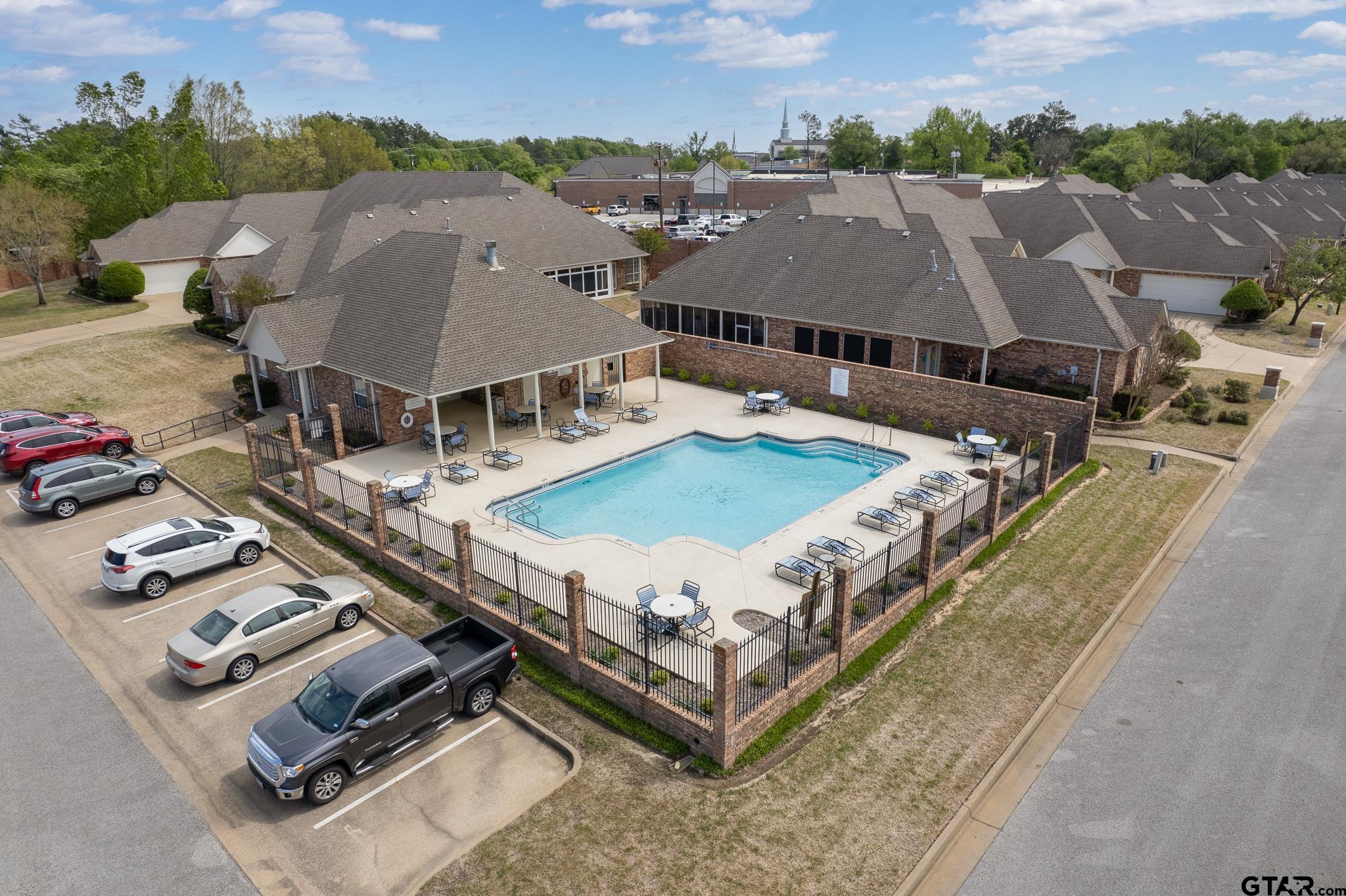 2431 Homestead Lane Tyler, TX 75701 - Photo 26 of 26 an aerial view of multiple houses with a terrace