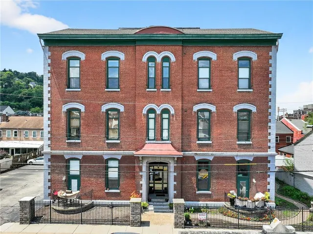 a front view of a multi story residential apartment building