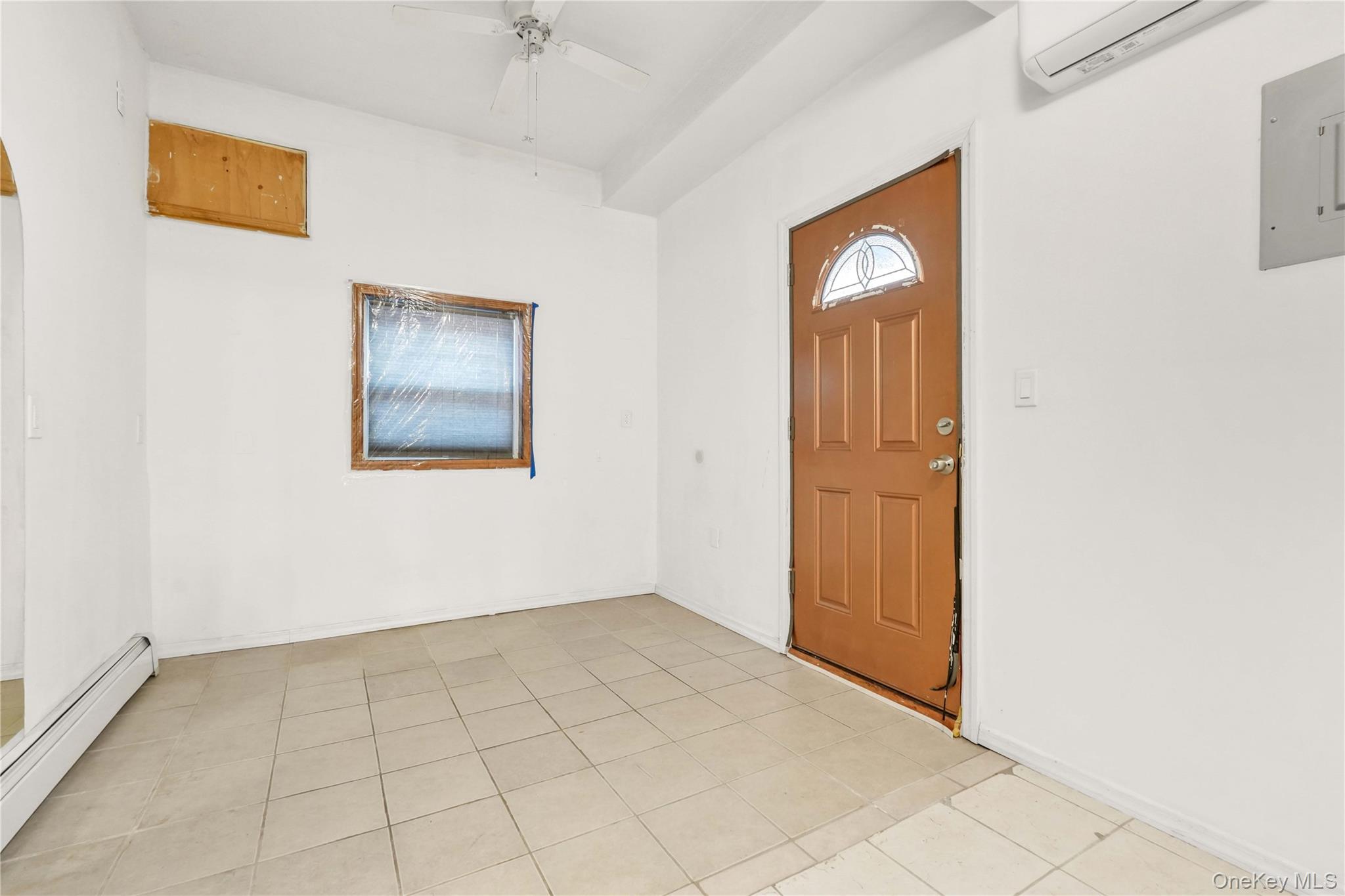 84-39 Lefferts Boulevard, Unit 1 Queens, NY 11415 - Photo 15 of 42 an empty room with windows and closet