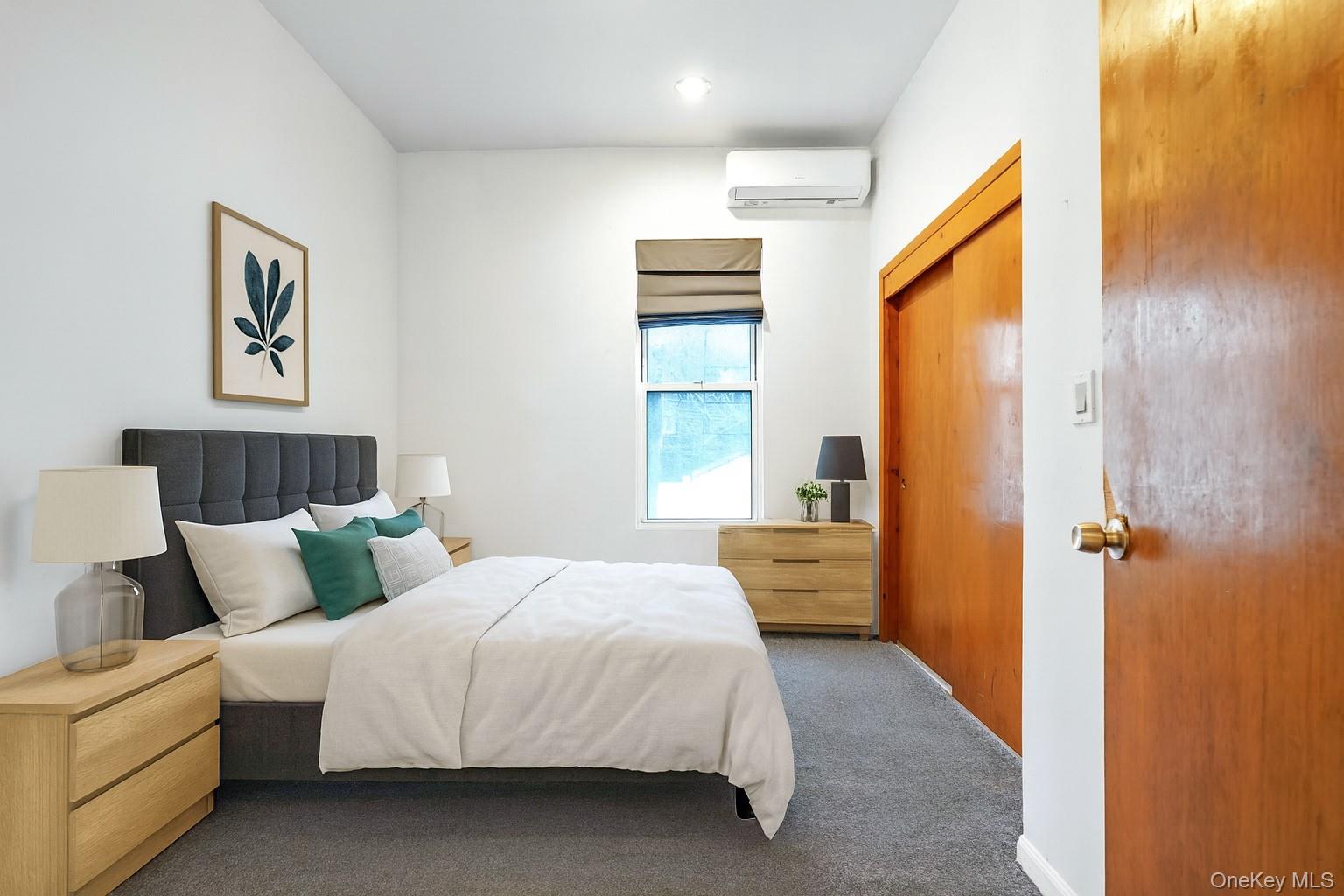 84-39 Lefferts Boulevard, Unit 1 Queens, NY 11415 - Photo 26 of 42 a bedroom with a bed and a painting on the wall