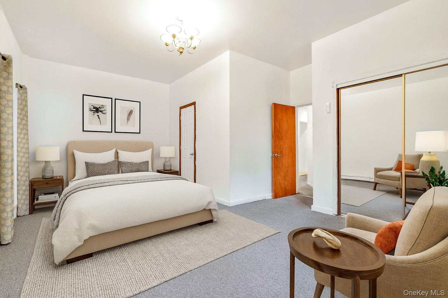 84-39 Lefferts Boulevard, Unit 1 Queens, NY 11415 - Photo 33 of 42 a spacious bedroom with a bed and glass windows