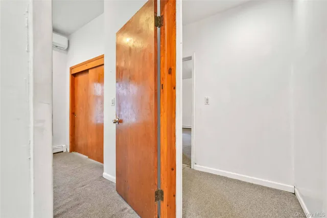 a view of a room with a stylish ceiling fan and entryway
