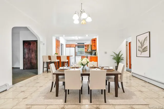 a view of a kitchen with a cabinet and a chandelier fan