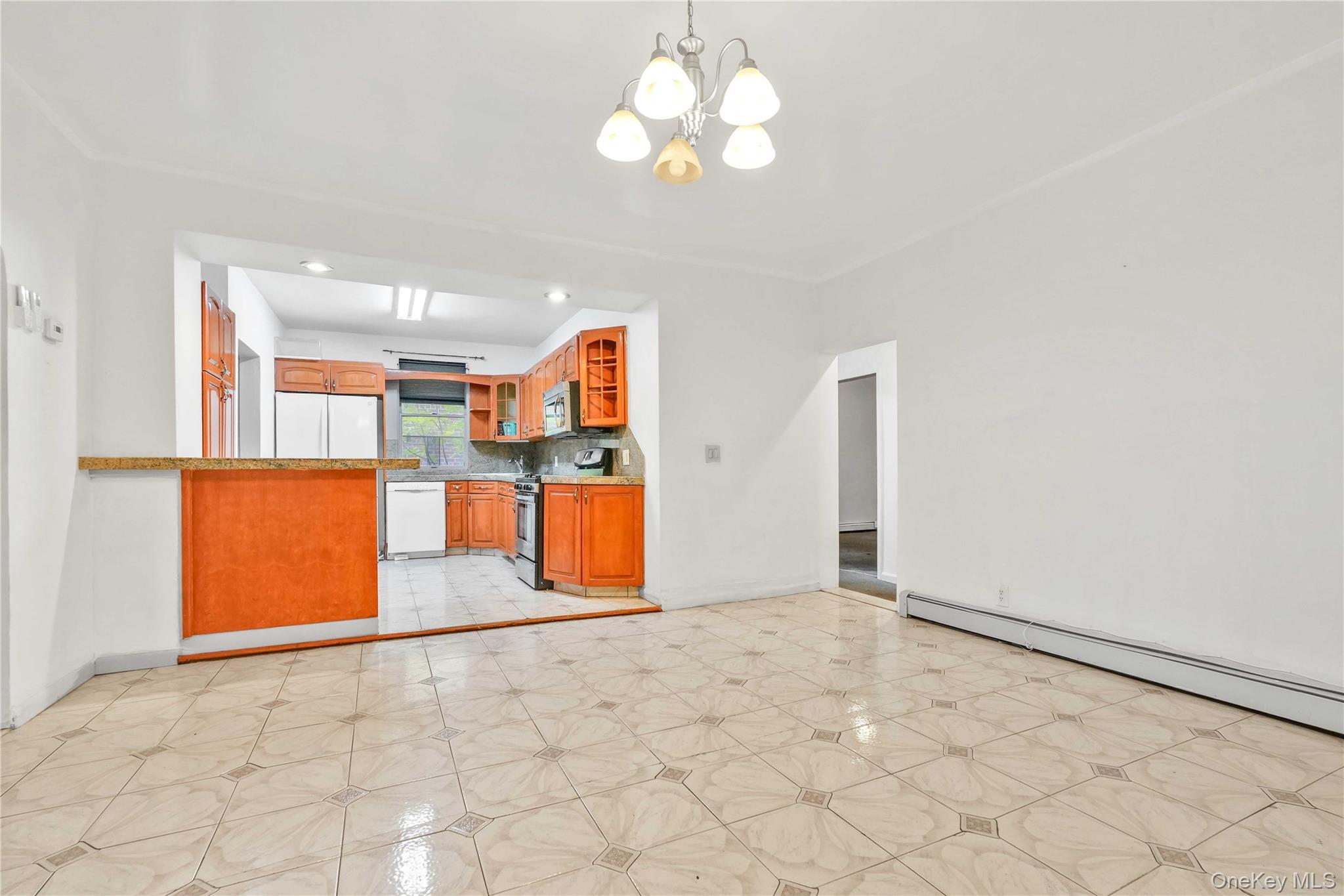 84-39 Lefferts Boulevard, Unit 1 Queens, NY 11415 - Photo 38 of 42 a view of a kitchen with a cabinet and a chandelier fan