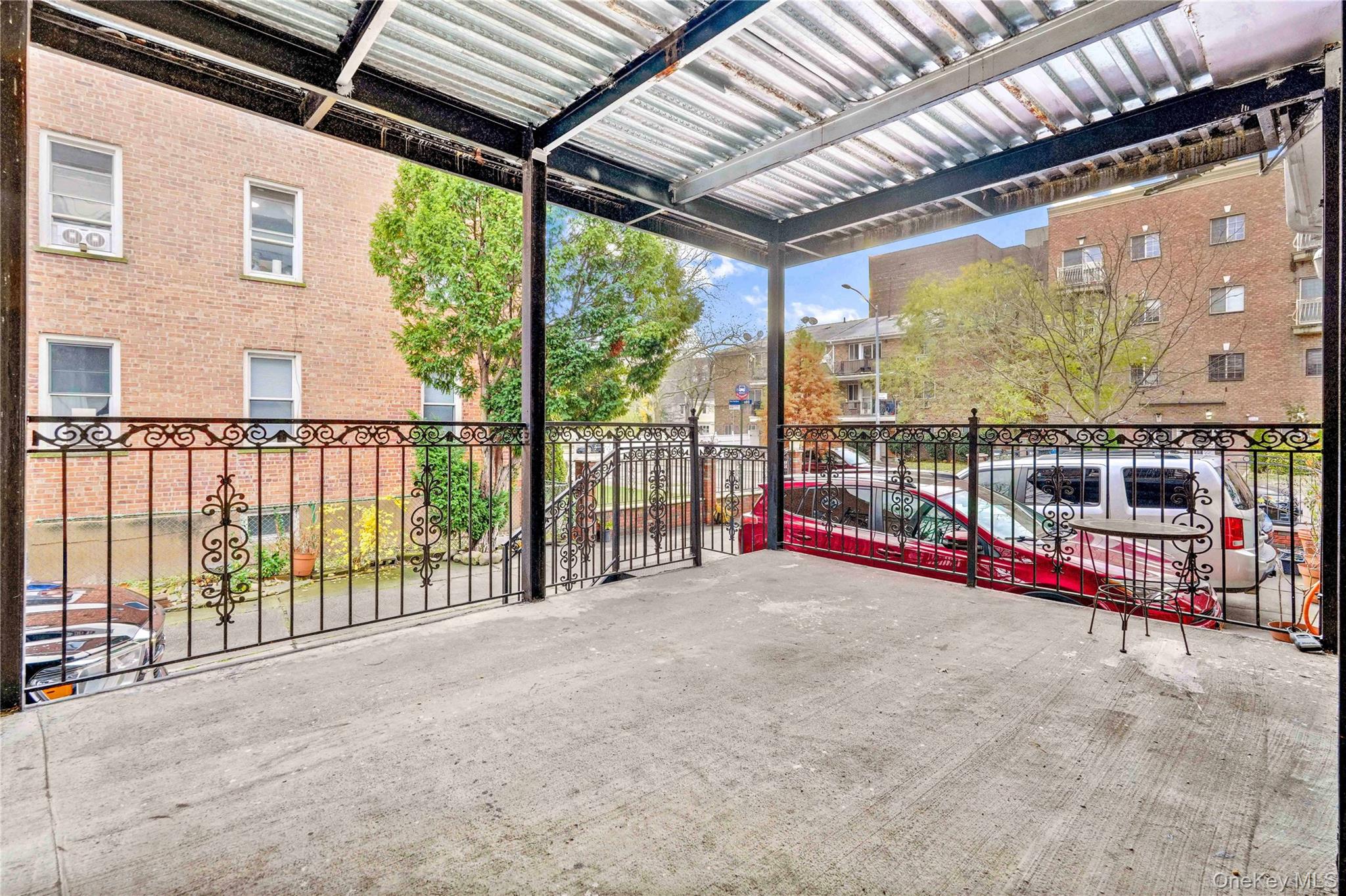 84-39 Lefferts Boulevard, Unit 1 Queens, NY 11415 - Photo 40 of 42 a view of a porch with wooden floor and roof