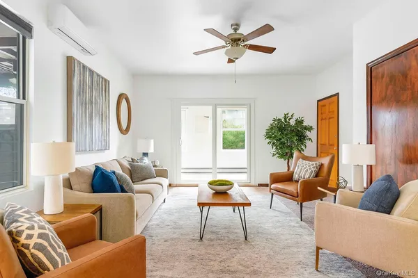 a living room with furniture and a large window