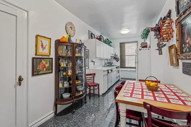a room with furniture a rug and gym equipment