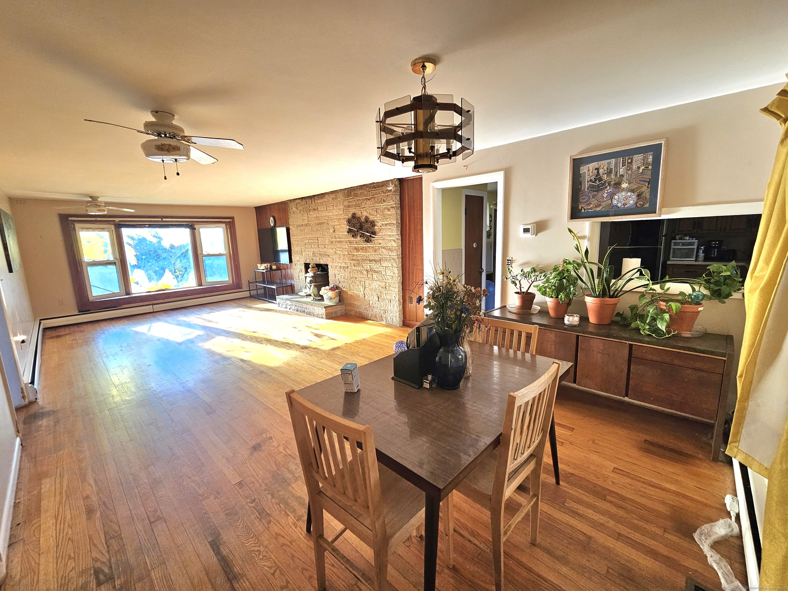 1415 North Road Killingly, CT 06241 - Photo 11 of 20 a view of a dining room with furniture and wooden floor