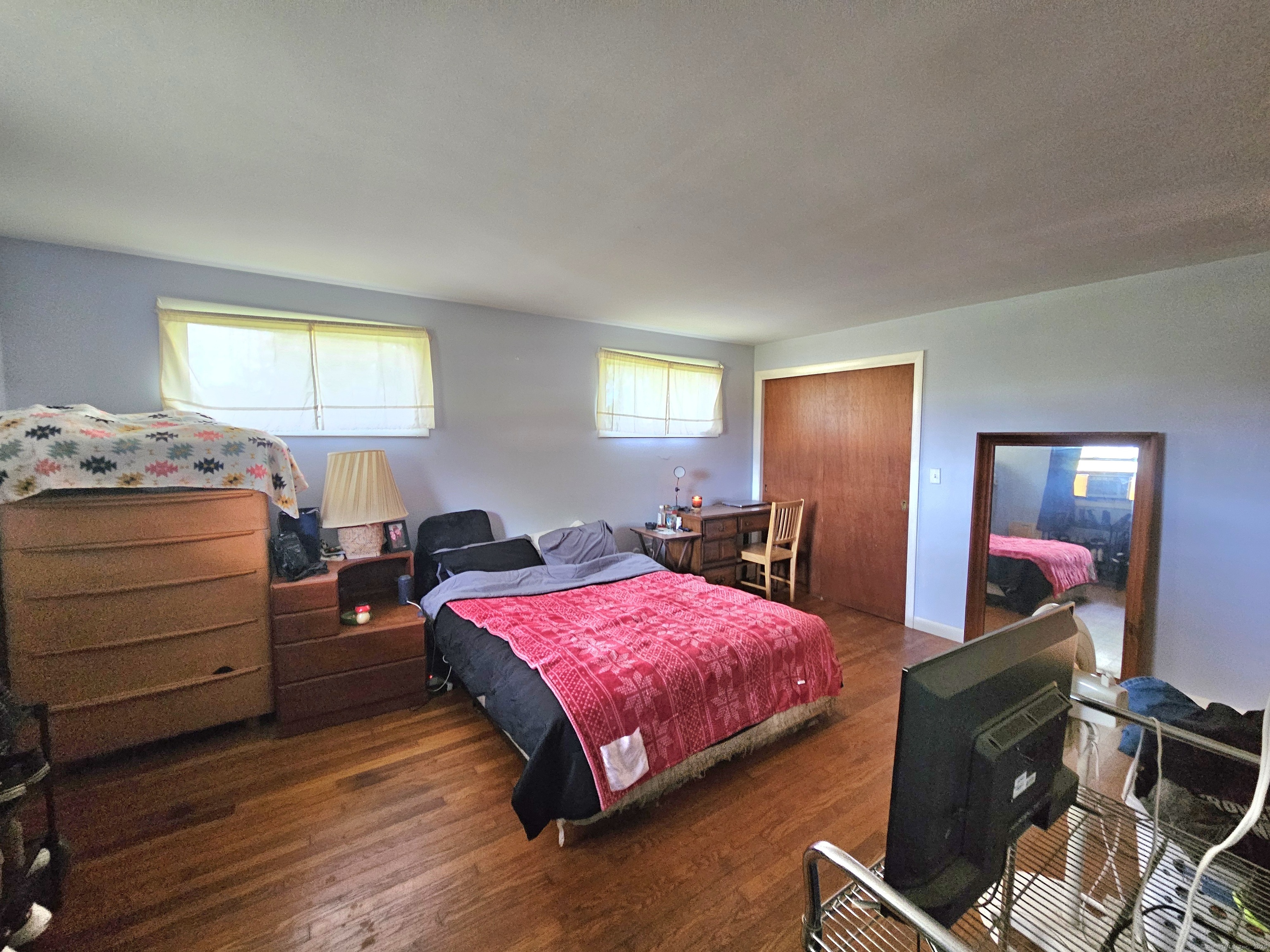1415 North Road Killingly, CT 06241 - Photo 15 of 20 a bedroom with a bed and wooden floor