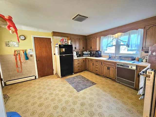 a bedroom with furniture and a window