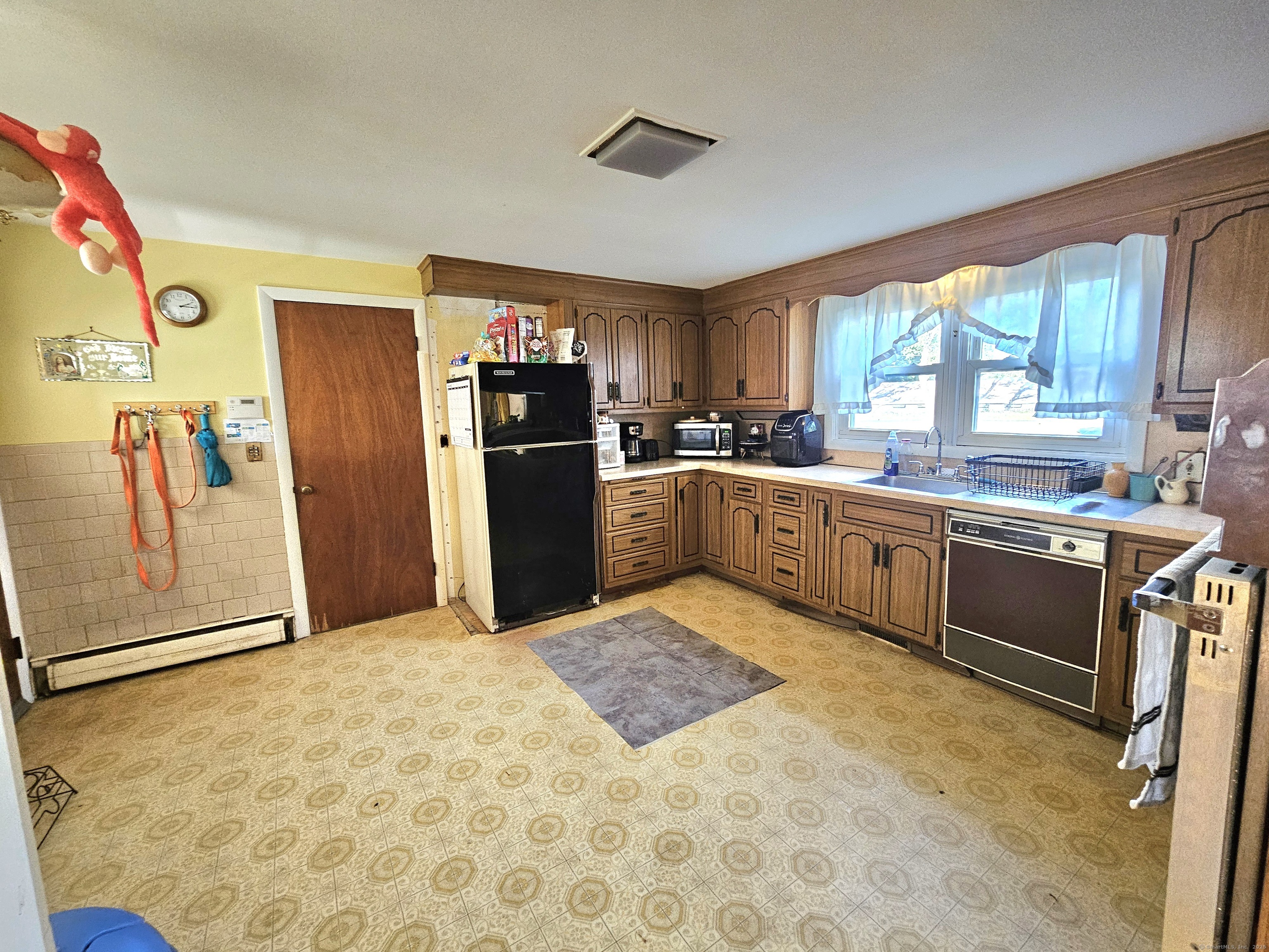 1415 North Road Killingly, CT 06241 - Photo 16 of 20 a kitchen with stainless steel appliances granite countertop a refrigerator sink and cabinets