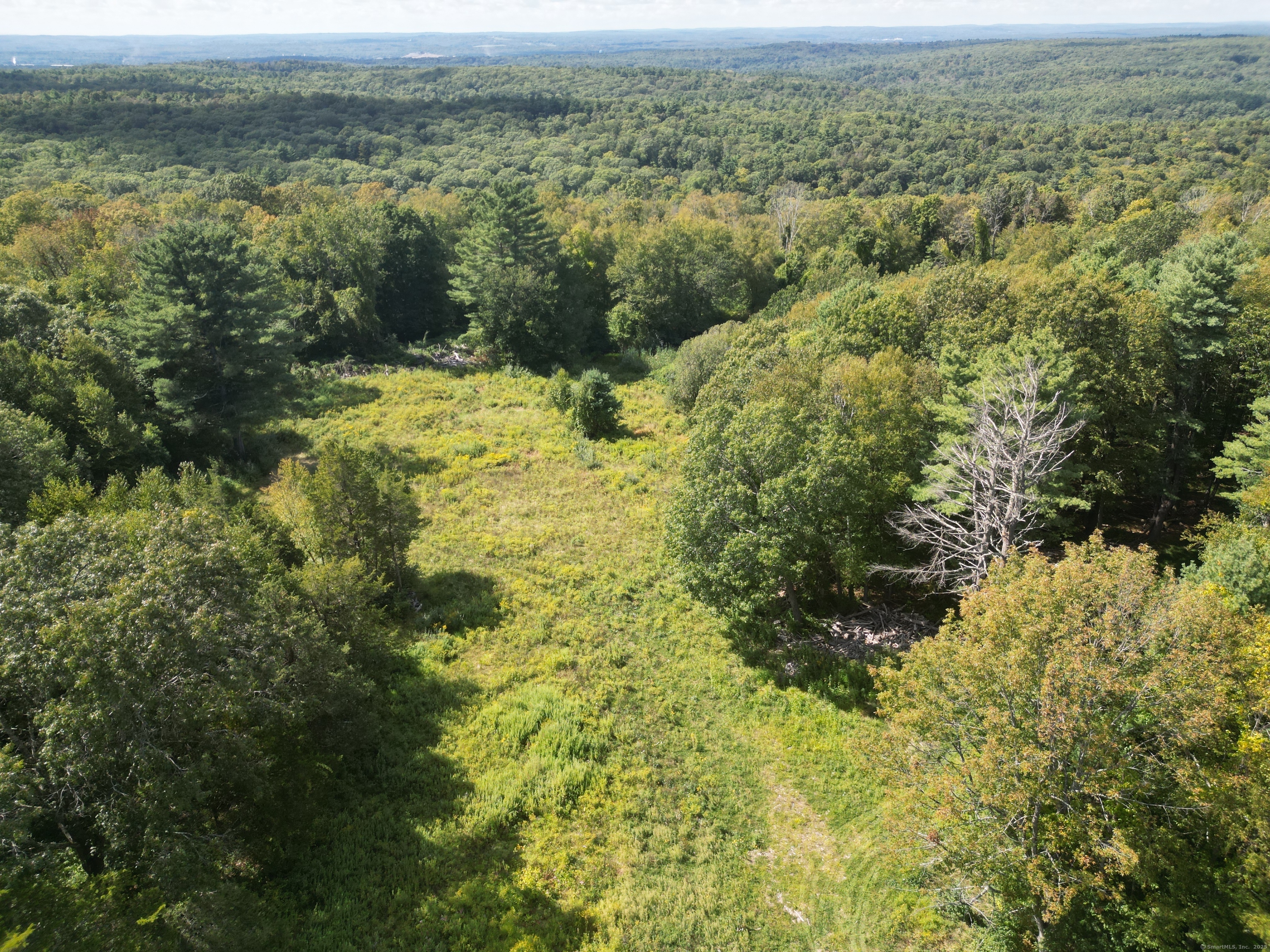 1415 North Road Killingly, CT 06241 - Photo 6 of 20 a view of a lake with a mountain in the background