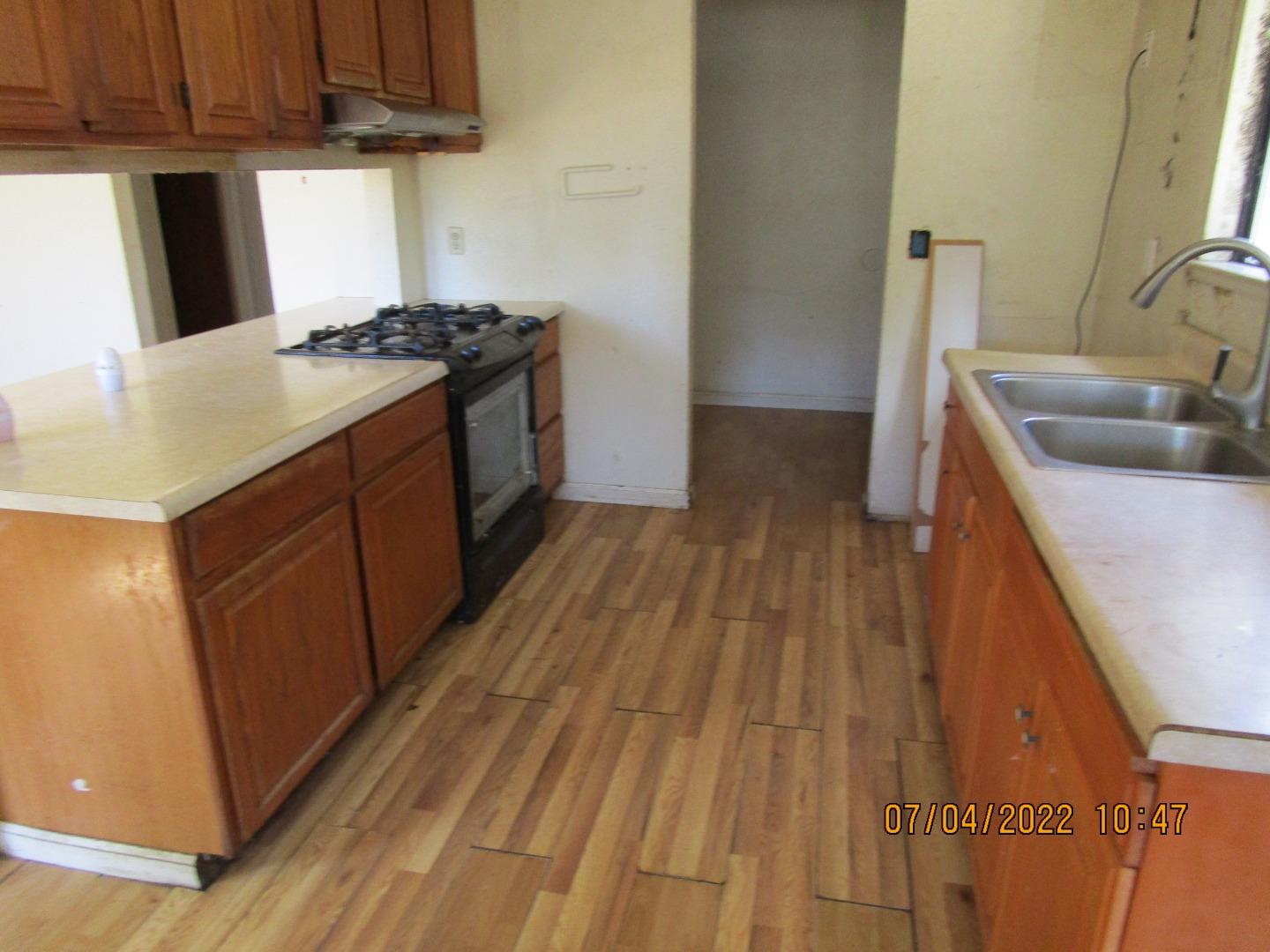 37 Webb Road Watsonville, CA 95076 - Photo 18 of 30 a kitchen with a sink a stove top oven and wooden floor