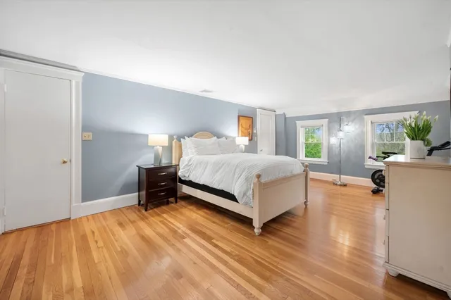 a bedroom with a bed and a table