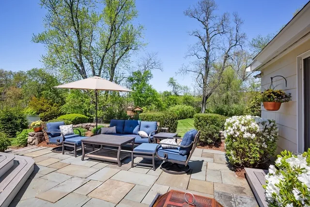 a view of a backyard with sitting area and furniture