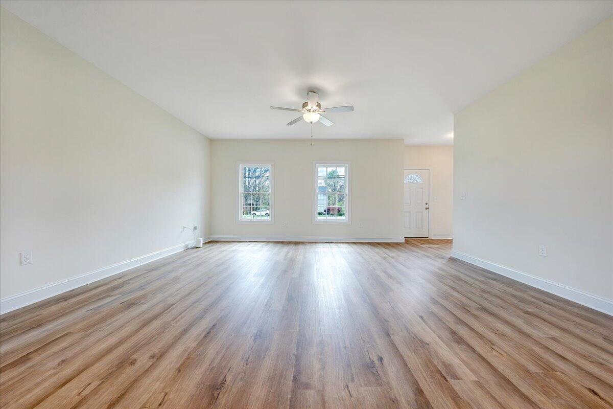 300 Ridgley Lane Fincastle, VA 24090 - Photo 4 of 19 an empty room with wooden floor and windows