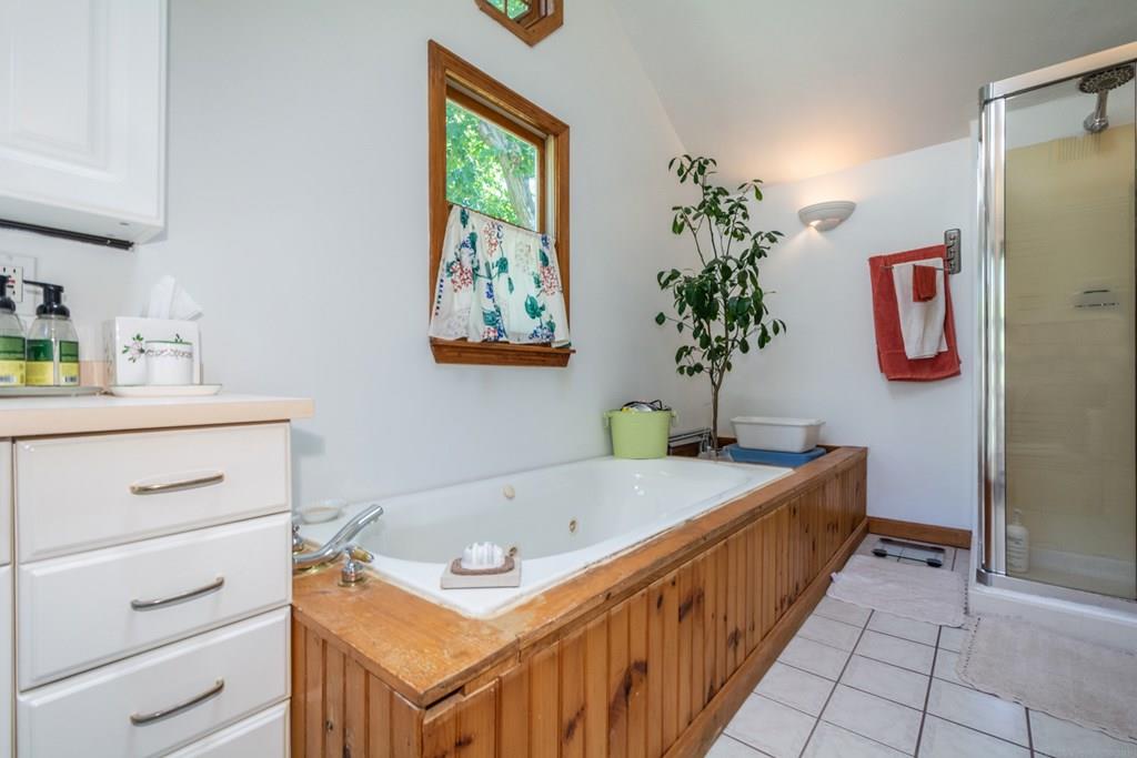 62 Theodore Road Newton, MA 02459 - Photo 15 of 29 a bathroom with a tub sink and mirror