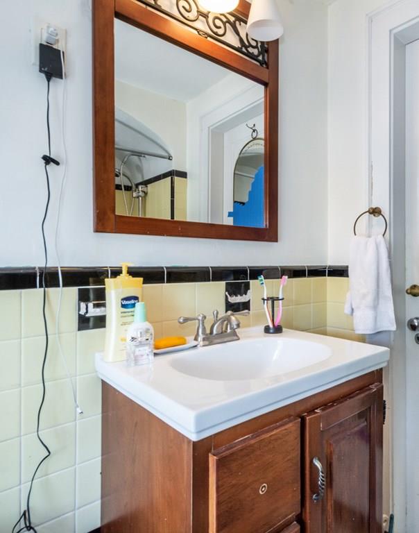 62 Theodore Road Newton, MA 02459 - Photo 21 of 29 a bathroom with a sink and a mirror