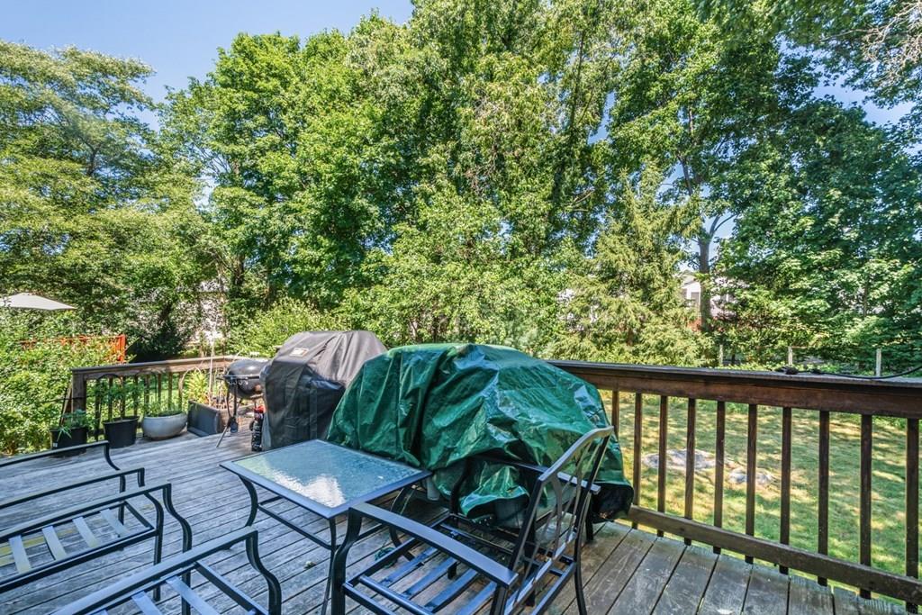 62 Theodore Road Newton, MA 02459 - Photo 23 of 29 a balcony with wooden floor and outdoor seating