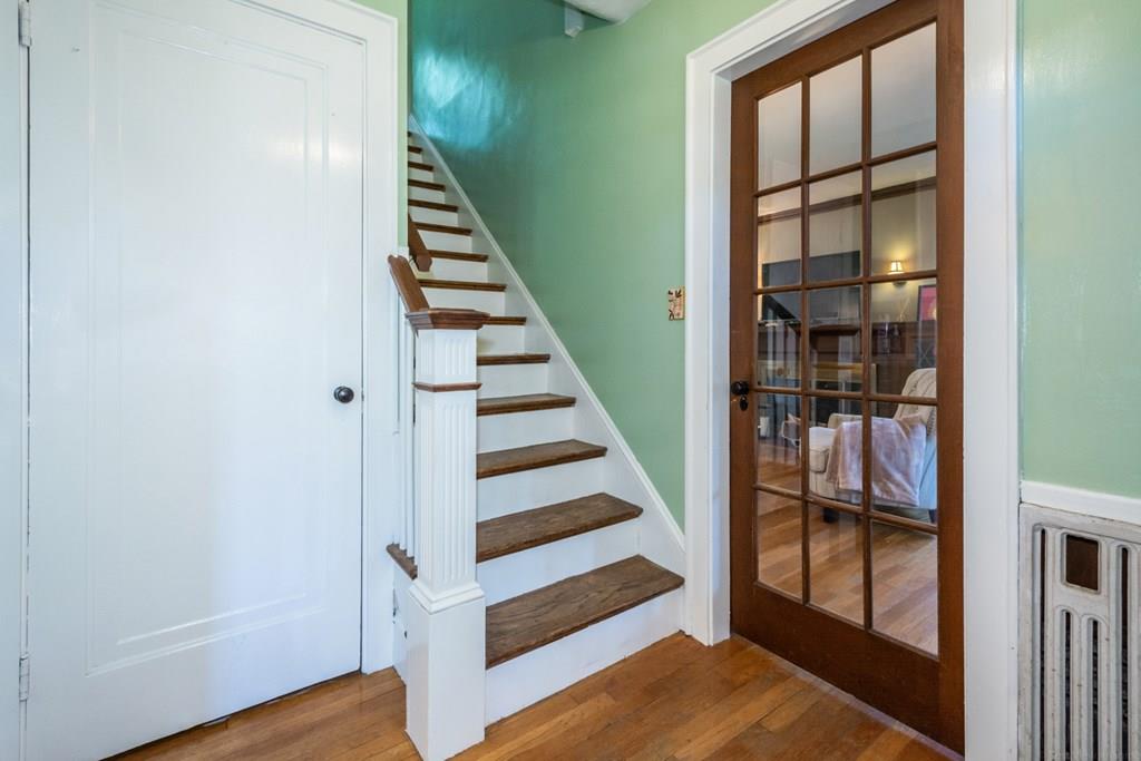 62 Theodore Road Newton, MA 02459 - Photo 3 of 29 a view of staircase with wooden floor and windows