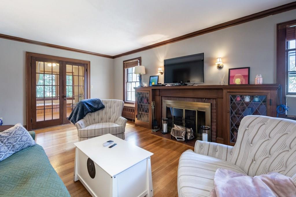 62 Theodore Road Newton, MA 02459 - Photo 4 of 29 a living room with furniture and a fireplace