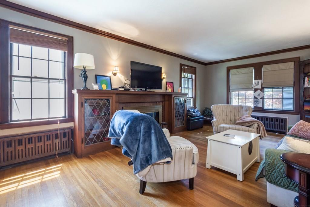 62 Theodore Road Newton, MA 02459 - Photo 5 of 29 a living room with furniture and a fireplace