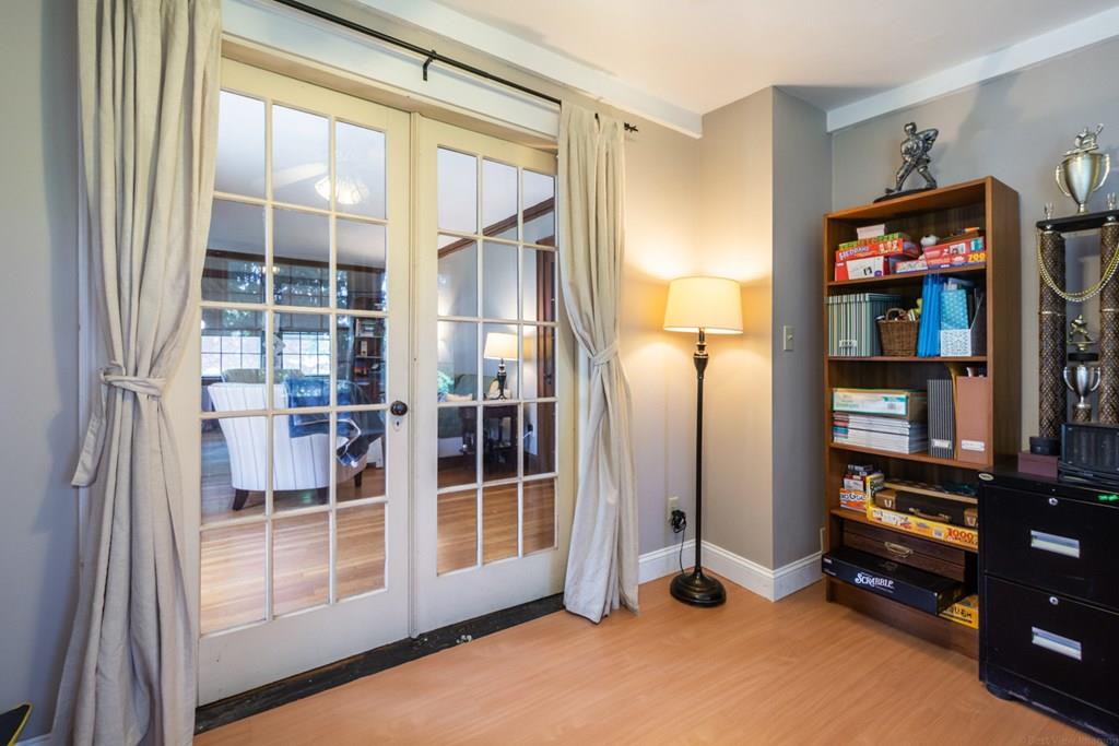 62 Theodore Road Newton, MA 02459 - Photo 7 of 29 a view of an empty room with bookshelf and a window