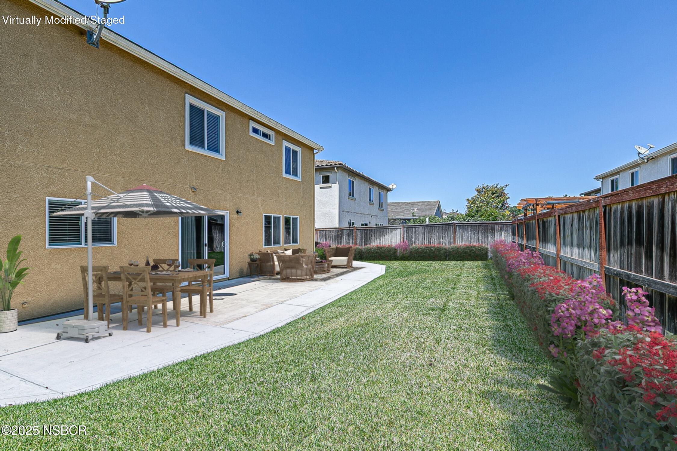 1104 Honda Way Lompoc, CA 93436 - Photo 11 of 36 a view of a backyard with sitting area