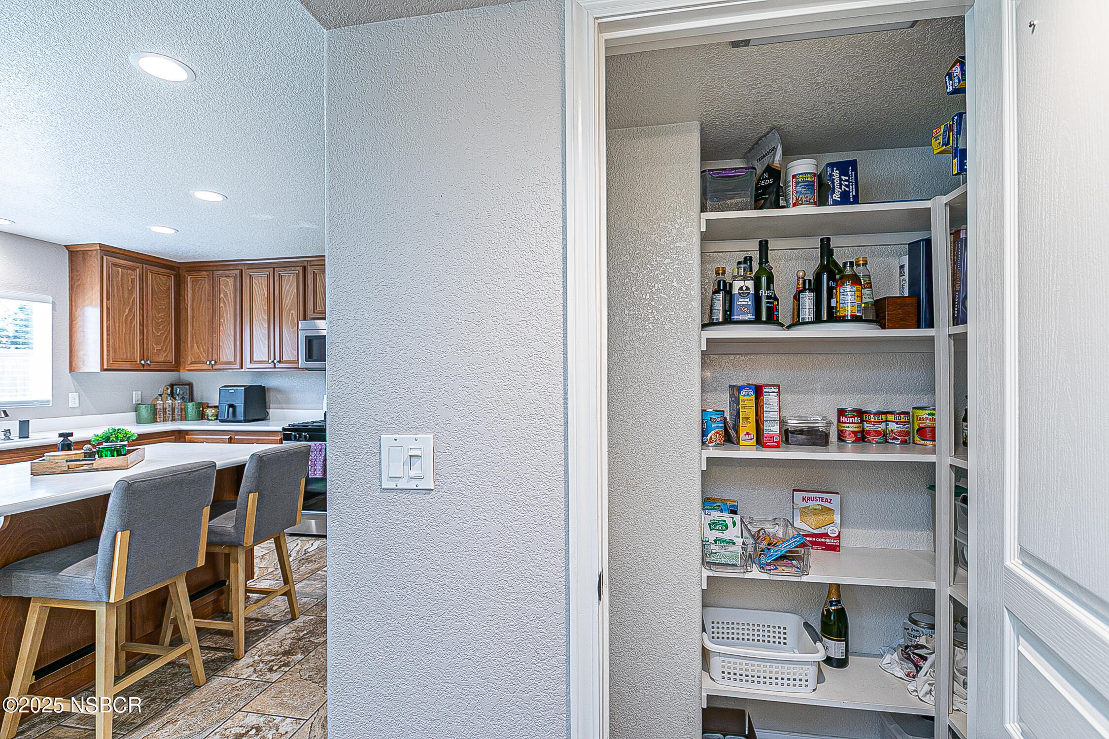 1104 Honda Way Lompoc, CA 93436 - Photo 21 of 36 a kitchen with a dining table and chairs