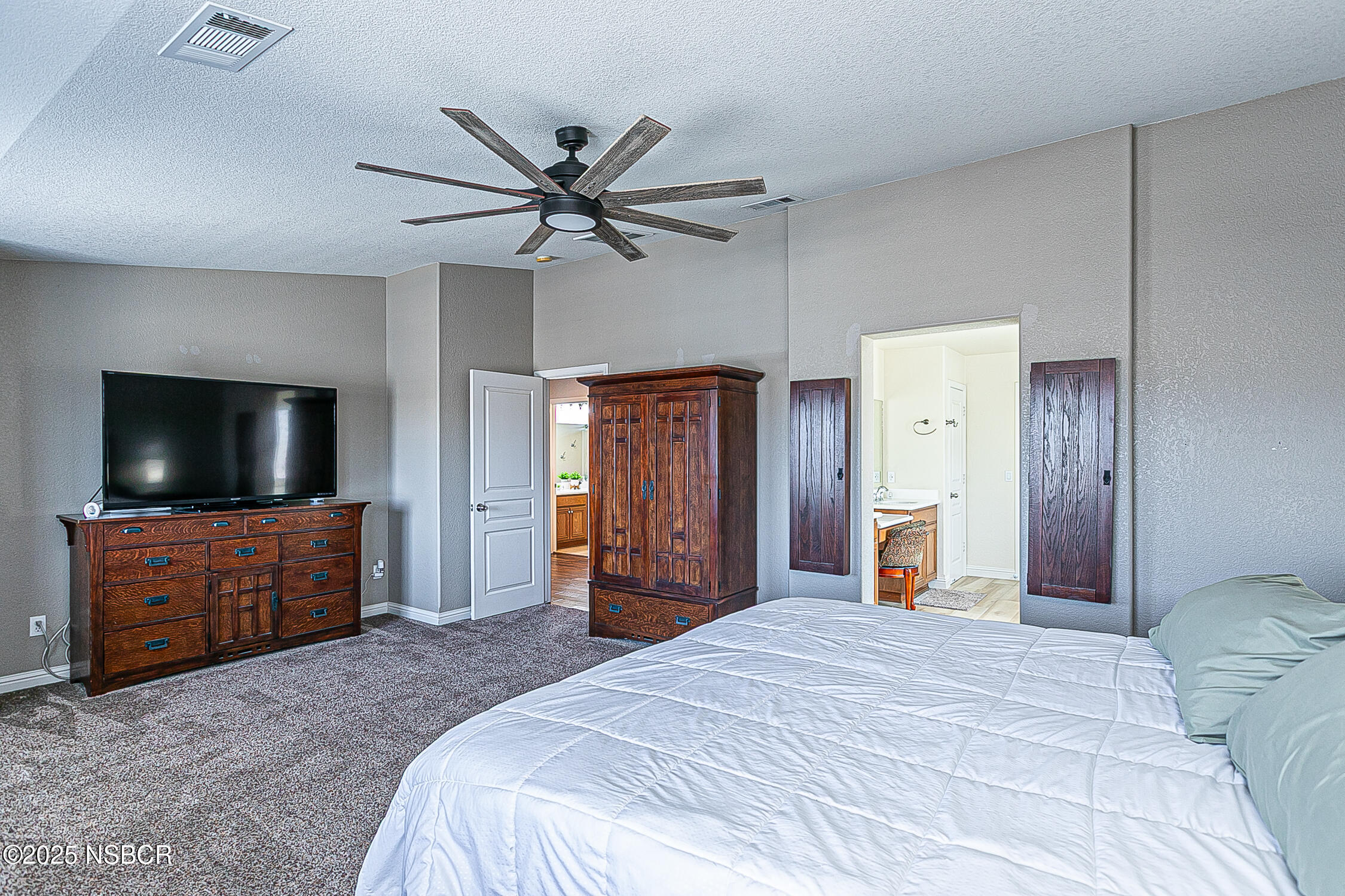 1104 Honda Way Lompoc, CA 93436 - Photo 22 of 36 a bedroom with a bed and a flat screen tv