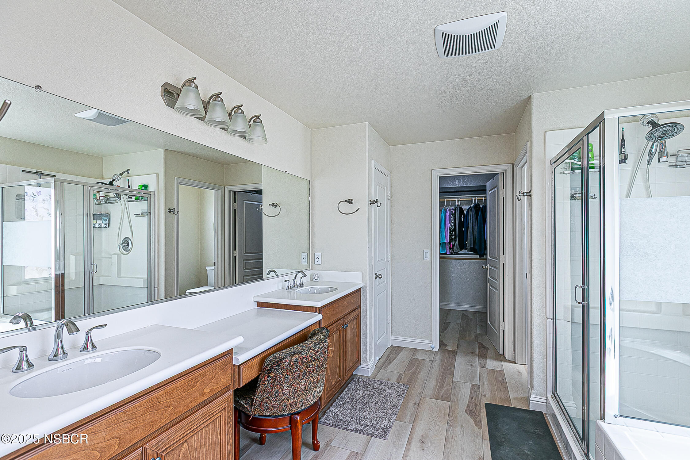 1104 Honda Way Lompoc, CA 93436 - Photo 23 of 36 a en suite bathroom with a double vanity sink a mirror and a shower