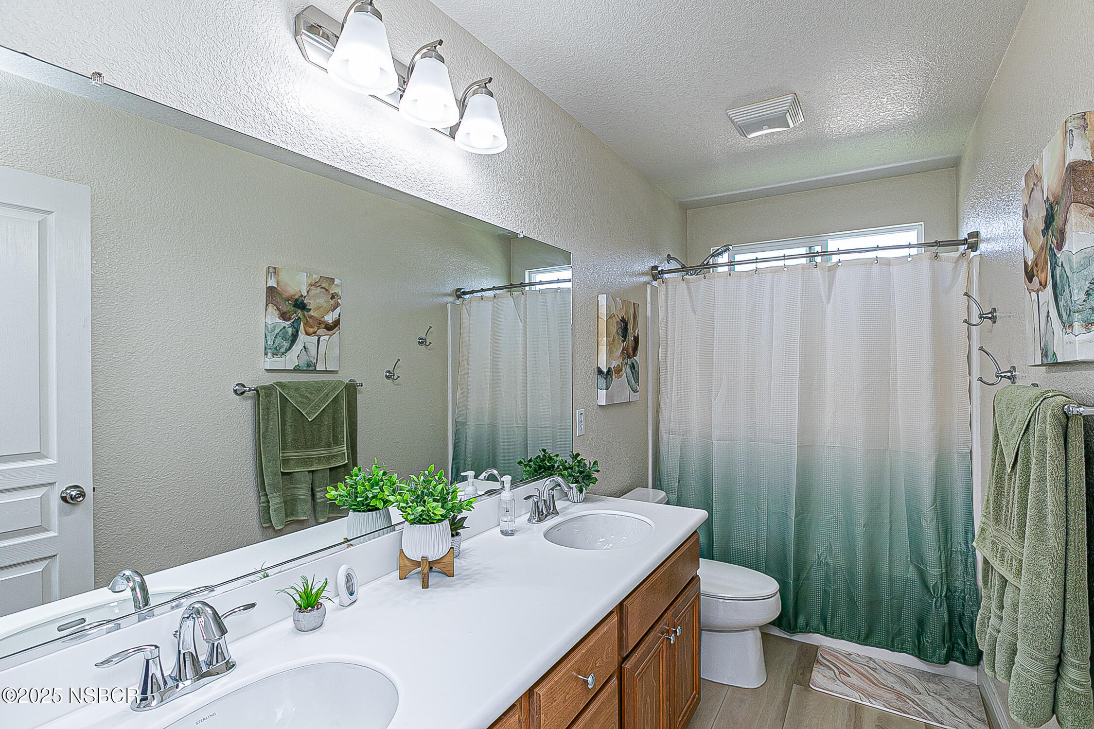 1104 Honda Way Lompoc, CA 93436 - Photo 26 of 36 a bathroom with a granite countertop sink a toilet and shower