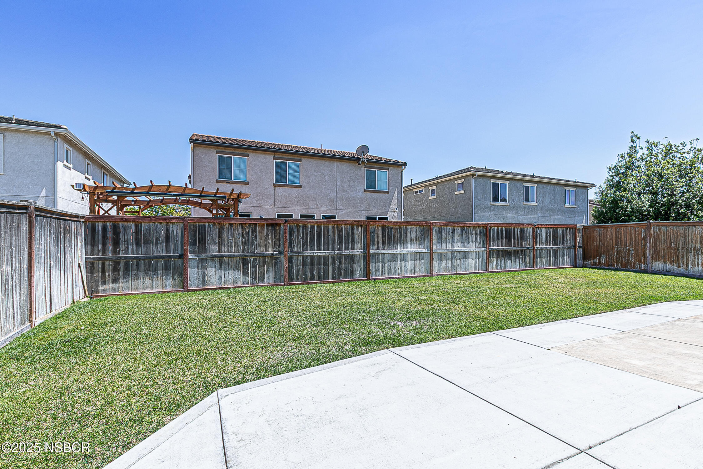 1104 Honda Way Lompoc, CA 93436 - Photo 29 of 36 a front view of a house with a yard and garage