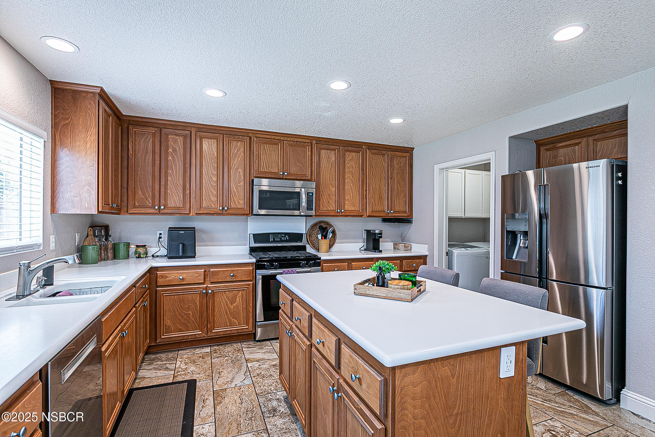1104 Honda Way Lompoc, CA 93436 - Photo 5 of 36 a kitchen with stainless steel appliances a sink stove refrigerator and cabinets