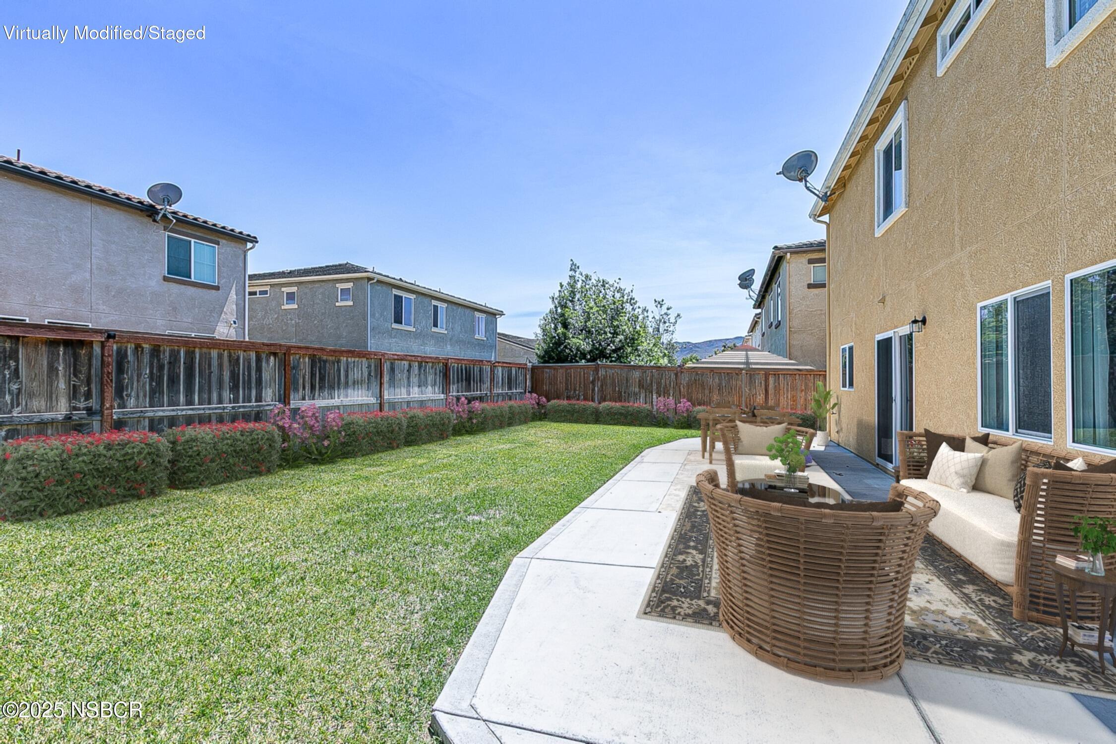 1104 Honda Way Lompoc, CA 93436 - Photo 10 of 36 a view of a patio with couches chairs and large trees