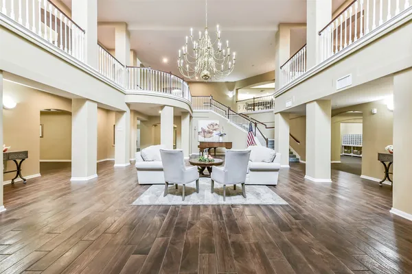 a lobby with furniture and wooden floor