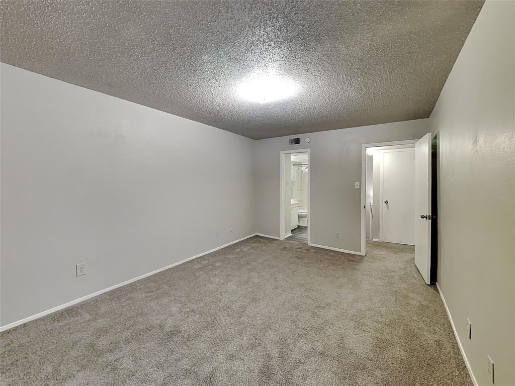 5618 Boca Raton Boulevard, Unit 143 Fort Worth, TX 76112 - Photo 8 of 10 an empty room with a natural light