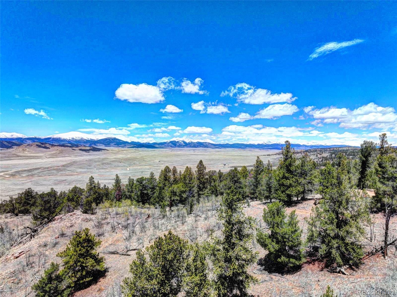 182 Starling Way Como, CO 80432 - Photo 6 of 37 a view of a lake with a yard
