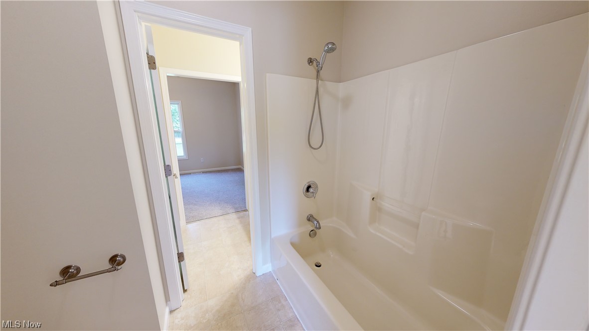 8325 Munson Road Mentor, OH 44060 - Photo 24 of 35 Bathroom with shower combination and light tile floors