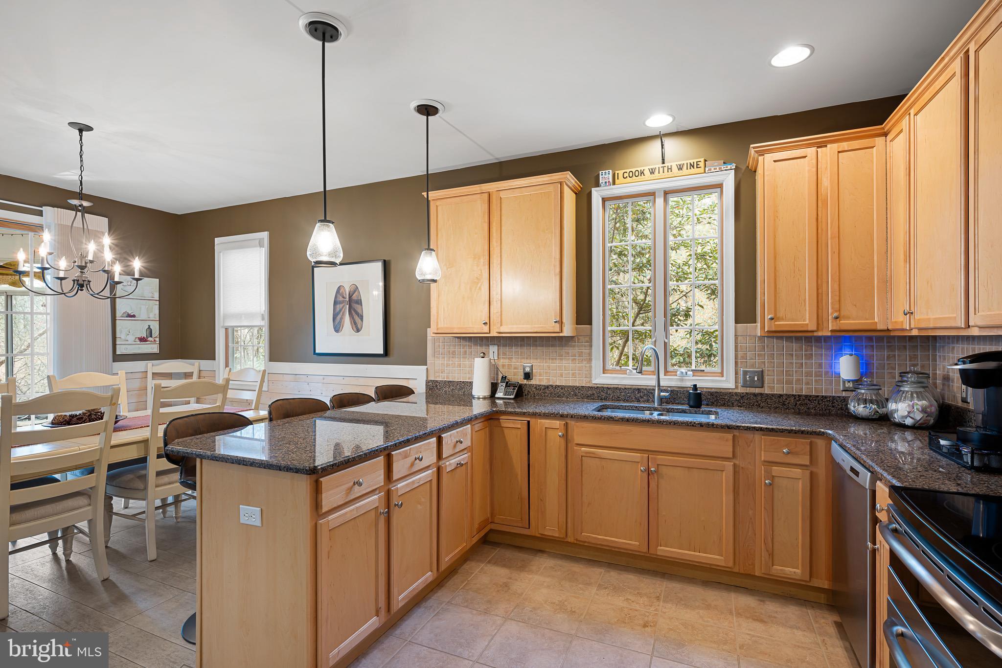 38744 Skipjack Village Road, Unit 14 Bethany Beach, DE 19930 - Photo 11 of 70 a kitchen with a sink stove and cabinets